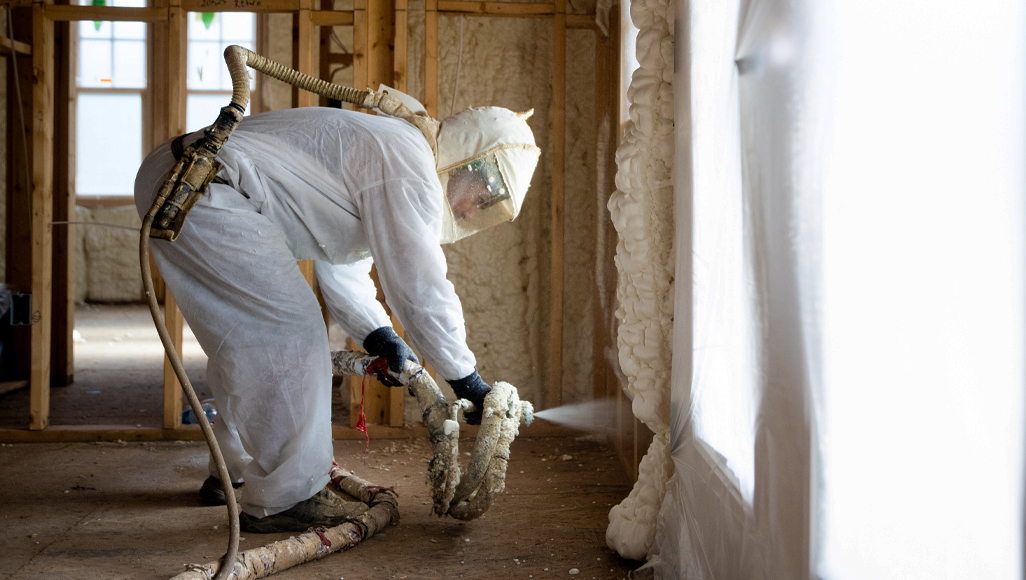 a foam contractor filling interior walls with Accufoam.