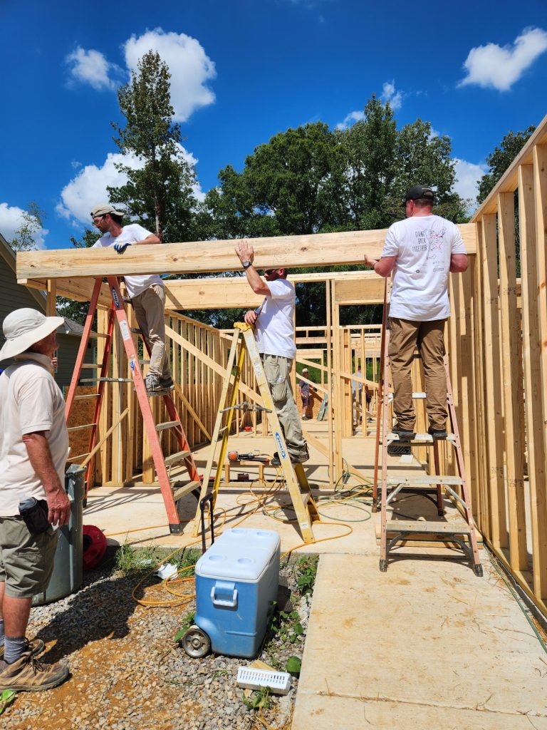 Members of the Rugged Coatings team working hard with Habitat for Humanity